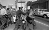 Rev. Martin Luther King, Jr., left, and Rev. Ralph Abernathy, right, leaders of the civil rights movement, are seen being hauled off to a paddy wagon by police following a demonstration in Birmingham, Ala., on April 12, 1963. 